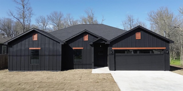 modern farmhouse with a garage, roof with shingles, board and batten siding, and driveway