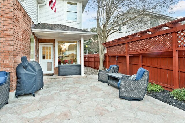 view of patio / terrace with area for grilling and fence private yard