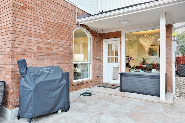 exterior space featuring central AC and grilling area