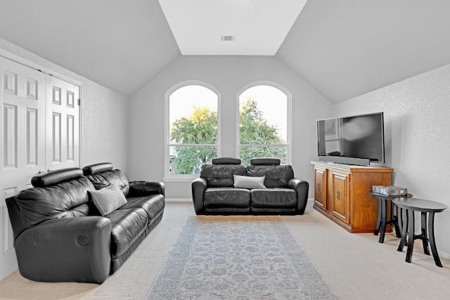 living room with lofted ceiling, carpet, and visible vents