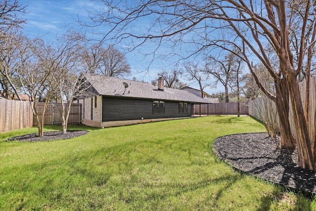 view of yard featuring a fenced backyard