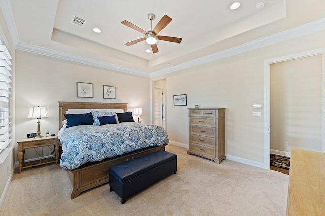 bedroom with light carpet, a raised ceiling, visible vents, and baseboards