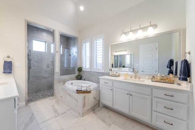 full bath with marble finish floor, vanity, a shower stall, and a bath