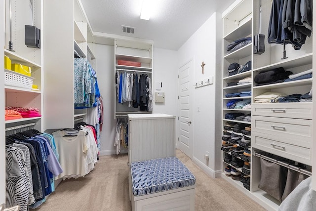 spacious closet with light carpet and visible vents