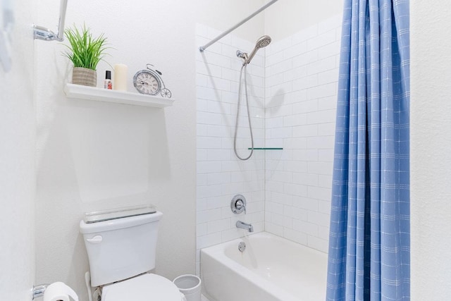 bathroom featuring toilet and shower / tub combo