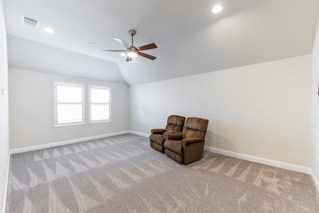 unfurnished room featuring a ceiling fan, visible vents, vaulted ceiling, baseboards, and carpet