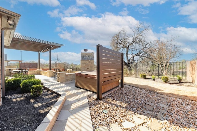 exterior space featuring a patio area, fence, and a pergola