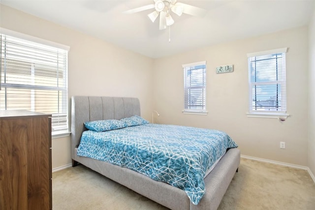 125 Danablu Dr, Hutto, TX 78634 - carpeted bedroom with baseboards and ceiling fan