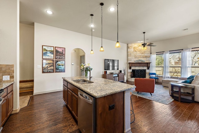 2618 Plantation Dr, Round Rock, TX 78681 - kitchen with appliances with stainless steel finishes, a sink, ceiling fan, arched walkways, and dark wood finished floors