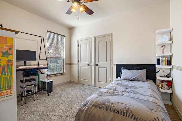 carpeted bedroom featuring a ceiling fan and baseboards