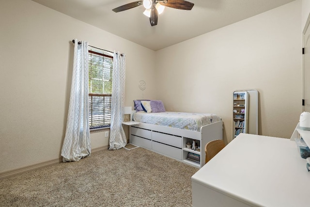 bedroom with baseboards, a ceiling fan, and carpet flooring