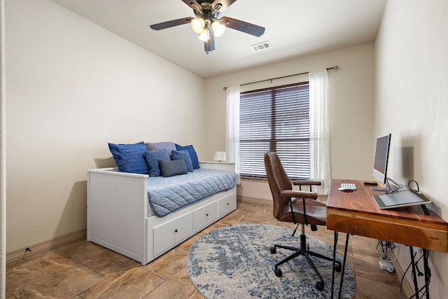 2618 Plantation Dr, Round Rock, TX 78681 - bedroom featuring baseboards, a desk, light stone finish floors, and ceiling fan