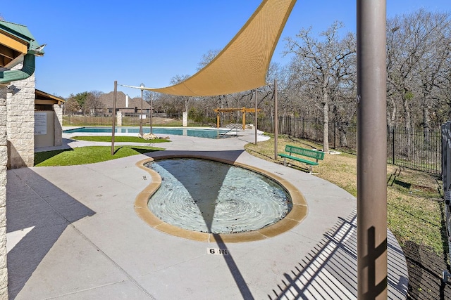 community pool featuring a patio area and fence