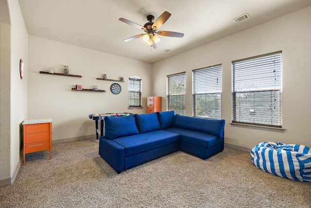 2618 Plantation Dr, Round Rock, TX 78681 - carpeted living room featuring a ceiling fan and baseboards