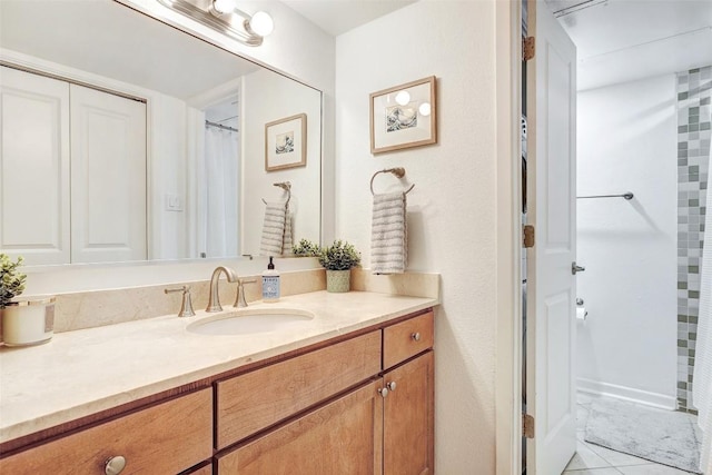 bathroom featuring tile patterned floors and vanity