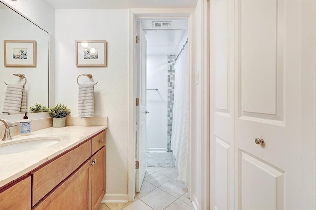 full bathroom with a shower with curtain, tile patterned flooring, visible vents, and vanity