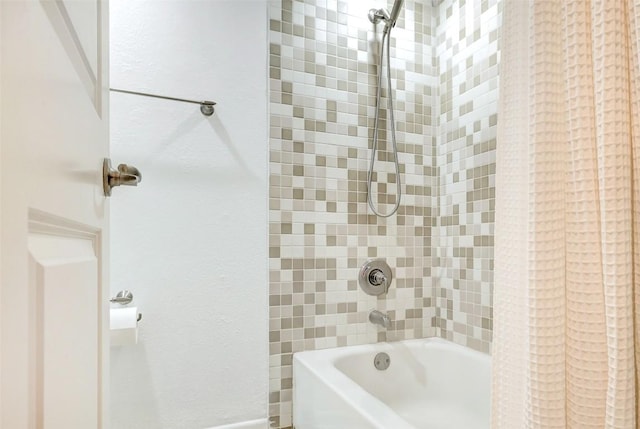 bathroom with shower / bath combo