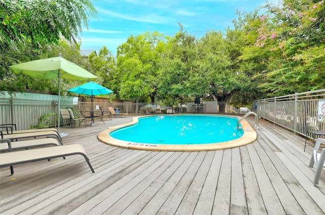 community pool featuring fence