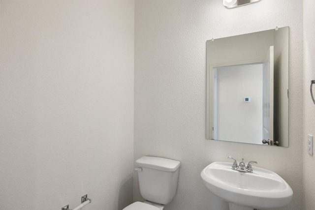 bathroom featuring a sink and toilet