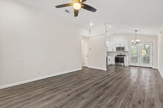 unfurnished living room with visible vents, dark wood-type flooring, vaulted ceiling, baseboards, and ceiling fan with notable chandelier