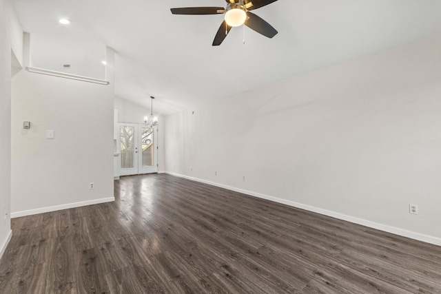 unfurnished living room featuring baseboards, dark wood-style flooring, ceiling fan with notable chandelier, vaulted ceiling, and recessed lighting