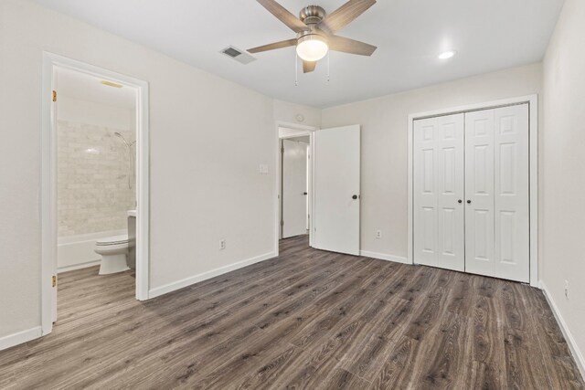 unfurnished bedroom with a closet, visible vents, connected bathroom, wood finished floors, and baseboards