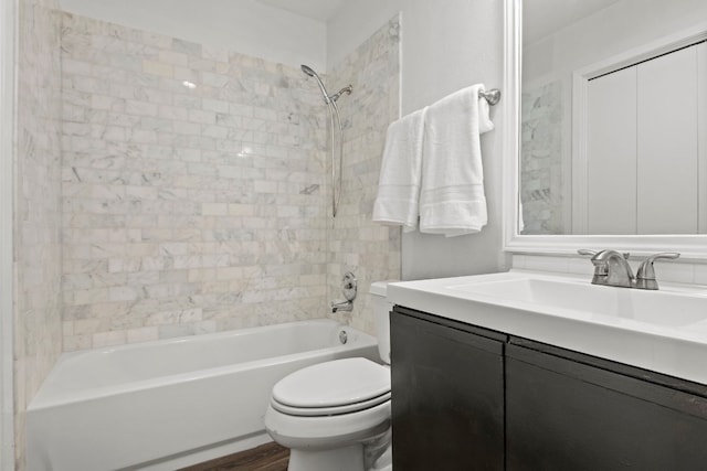 bathroom with shower / bath combination, vanity, toilet, and wood finished floors