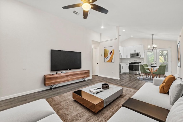 living area featuring vaulted ceiling, dark wood-style floors, visible vents, and baseboards