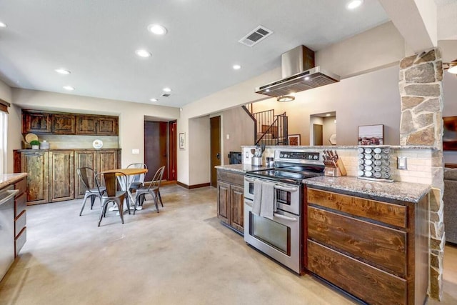 kitchen featuring recessed lighting, visible vents, baseboards, double oven range, and light stone countertops