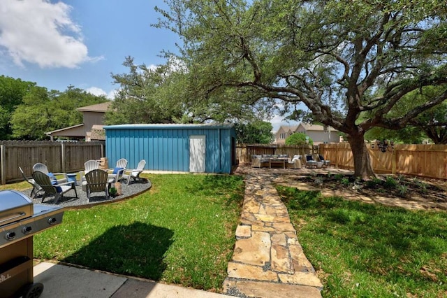 view of yard featuring an outdoor fire pit, a patio area, and a fenced backyard