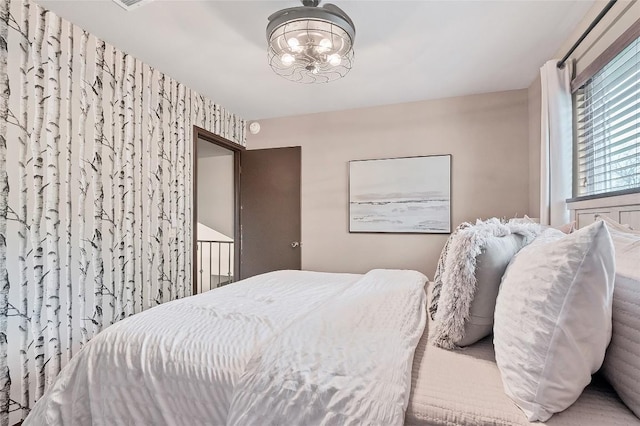 bedroom with a chandelier