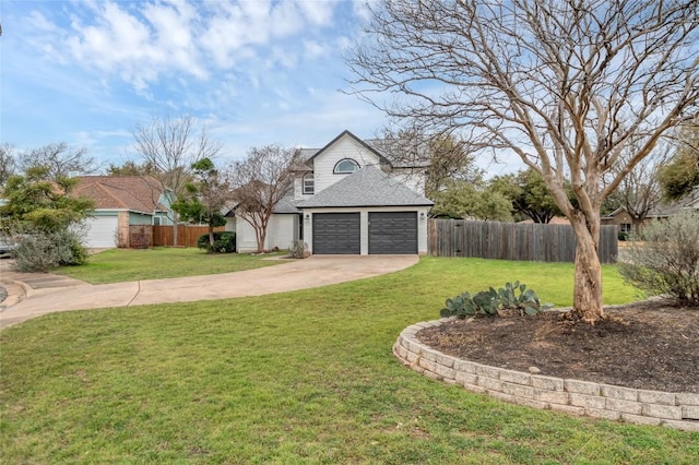 view of yard with a garage, driveway, and fence