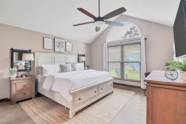 bedroom with a ceiling fan, vaulted ceiling, and finished concrete flooring