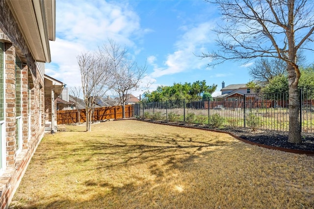 view of yard featuring a fenced backyard