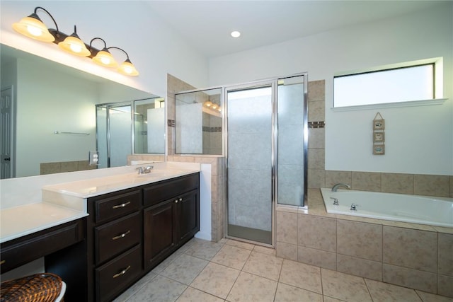 full bath featuring tile patterned flooring, a garden tub, a shower stall, and vanity