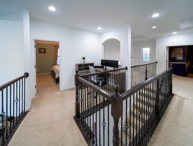 corridor with recessed lighting, attic access, light carpet, an upstairs landing, and baseboards