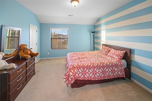 bedroom featuring light carpet, baseboards, visible vents, and vaulted ceiling