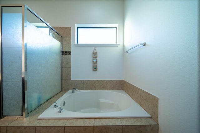 bathroom with a garden tub