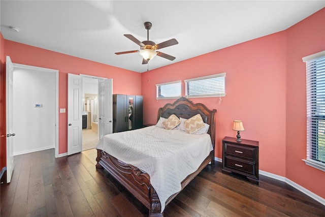 bedroom featuring wood finished floors, a ceiling fan, and baseboards