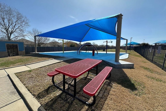 surrounding community featuring fence and a lawn