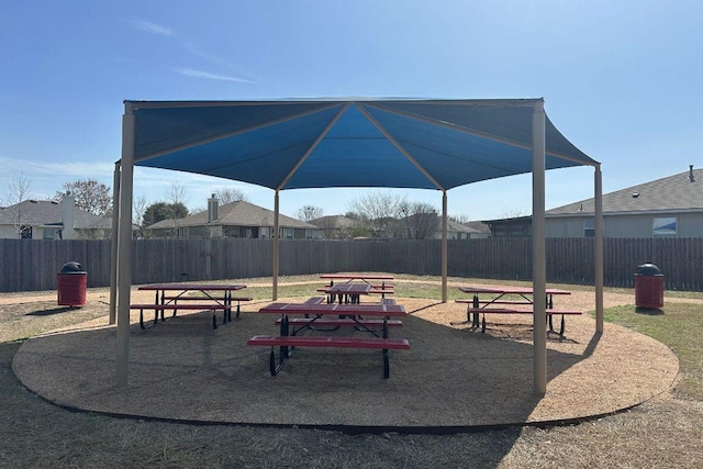 surrounding community with playground community and fence