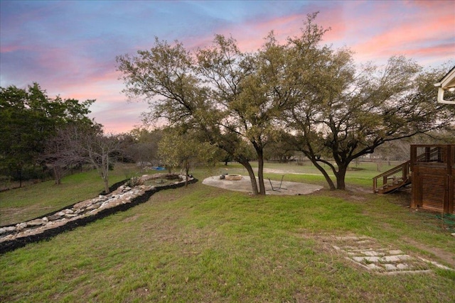 view of yard with a patio, an outdoor fire pit, and stairway