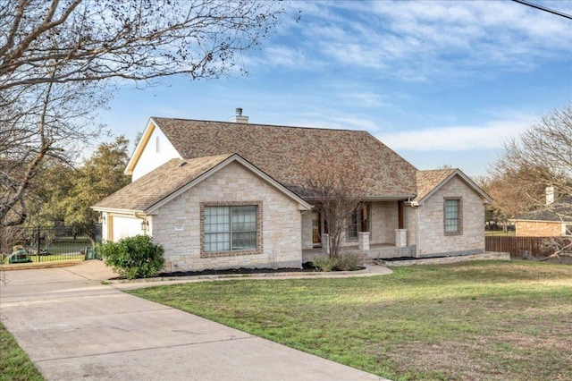 view of front of house featuring driveway, a chimney, fence, a porch, and a front yard