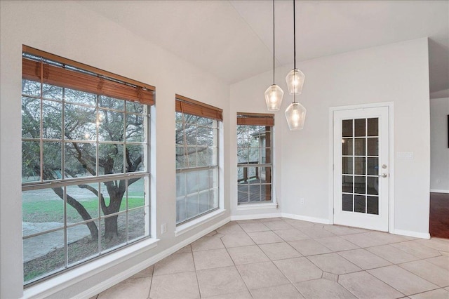 unfurnished sunroom with lofted ceiling