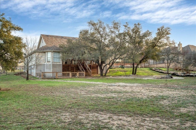 view of yard featuring stairs and a wooden deck