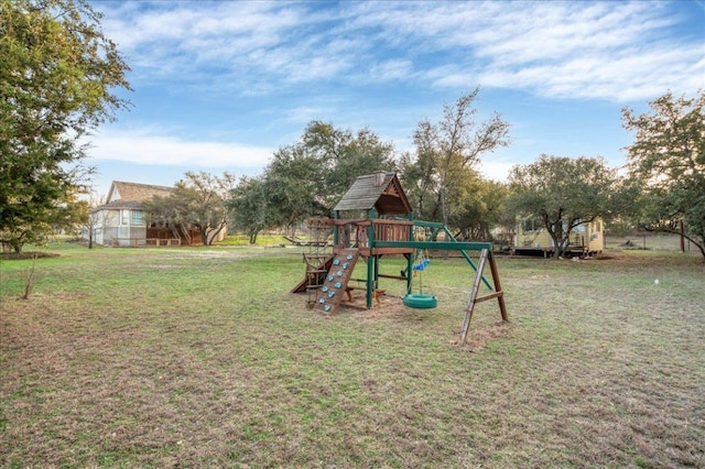 view of jungle gym with a lawn