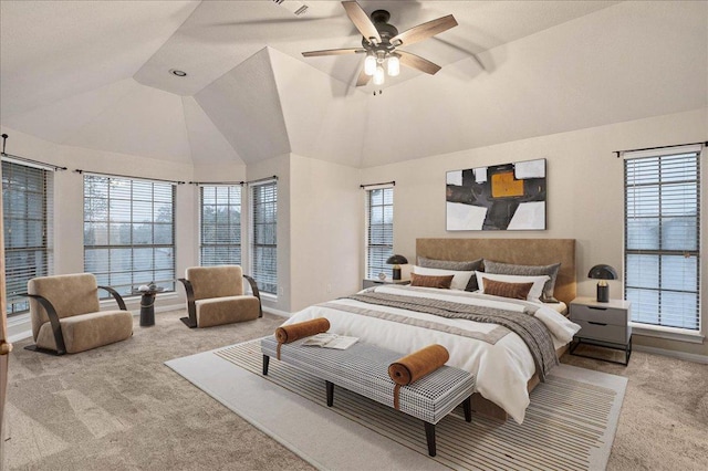 carpeted bedroom featuring vaulted ceiling, multiple windows, and baseboards