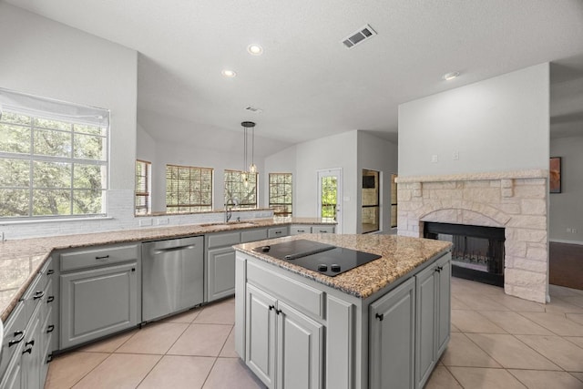 300 Speed Horse, Liberty Hill, TX 78642 - kitchen featuring dishwasher, black electric stovetop, gray cabinetry, a center island, and light tile patterned floors