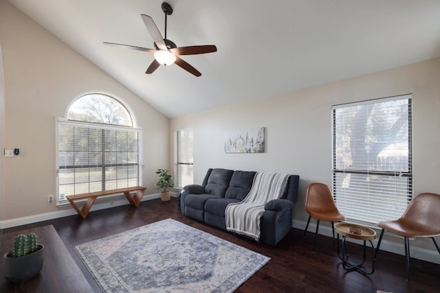living area featuring a ceiling fan, high vaulted ceiling, wood finished floors, and baseboards