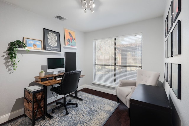 office area with wood finished floors and baseboards